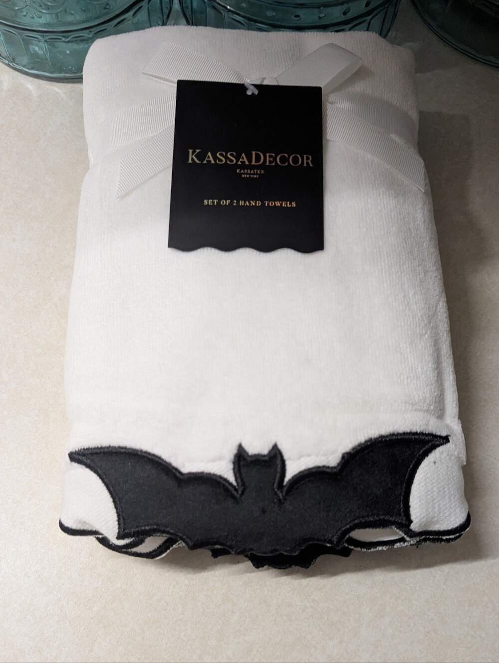 White Hand Towels with Scalloped Black Bat Design.